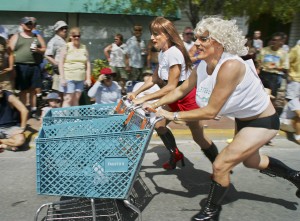 A female impersonator, known as Gina Maseratti, left, and Gary "Trampie" Drews, both of Key West, Fla., compete in the Conch Republic Drag Race in Key West.