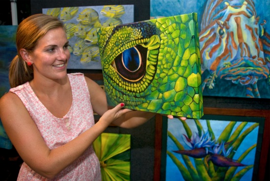 Artist Michelle Lowe, shows some of her creations during the monthly Third Thursday Artwalk in the Morada Way Arts & Cultural District in Islamorada, Florida Keys. Each third Thursday the district showcases the fine arts, music and culinary nuances of the Purple Isles, the Morada Way Arts & Cultural District features national and local artisans who are showcased in galleries at Morada Way between mile marker 81 and 82 - formerly named Industrial Road - as well as "culinary art" and live music. Photo by Andy Newman/Florida Keys News Bureau