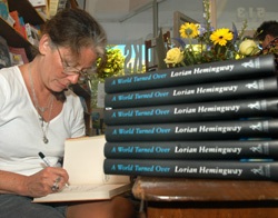 KEY WEST, Fla. -- Lorian Hemingway, granddaughter of Ernest Hemingway, signs copies of her latest book, "A World Turned Over," at Key West Island Book Store, during the Hemingway Days festival. Lorian Hemingway also announced winners of her 22-