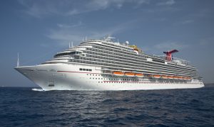 The Carnival Vista cruises at sea. The largest and most innovative cruise vessel in Carnival Cruise Line's fleet, Carnival Vista measures 133,500 tons, 1,055 feet long and has a guest capacity of almost 4,000 passengers. Photo by Andy Newman/Carnival Cruise Line